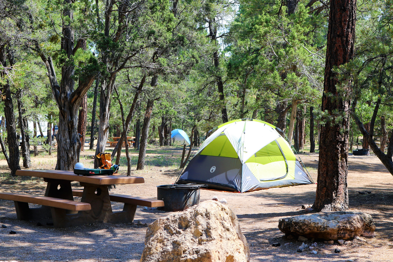 Tent, picnic table, and fire ring at a Mather Campground site on the South Rim